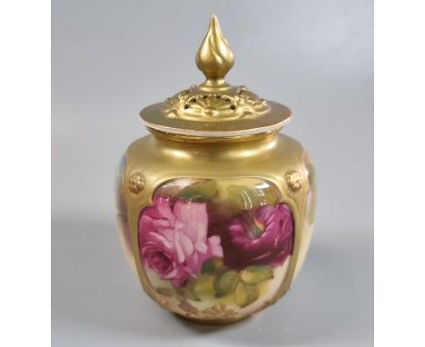 Royal Worcester porcelain potpourri vase and reticulated cover, hand painted with panels of roses and foliage, shape No. 162.