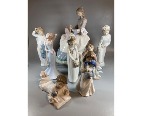 Group of Nao Spanish porcelain figurines to include: six figurines of children and a larger seated figurine of a lady doing e