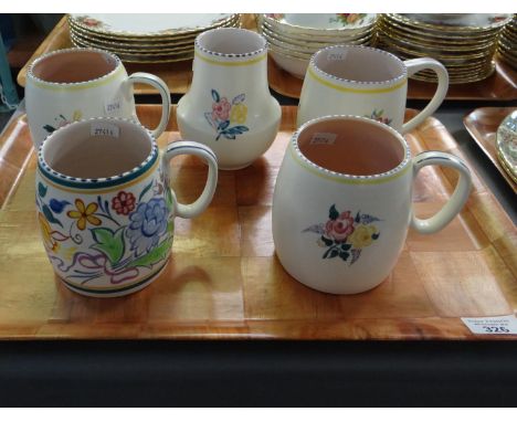 Tray containing four Poole pottery hand decorated floral mugs and a vase.(B.P. 21% + VAT) 