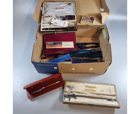 Shoe box of oddments to include: writing instruments, quill pen, boxed pens, compass tool  etc.  (B.P. 21% + VAT) 