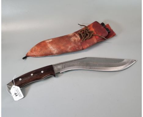 Nepalese Kukri with hardwood handle and leather scabbard with two small additional knives.  (B.P. 21% + VAT) 