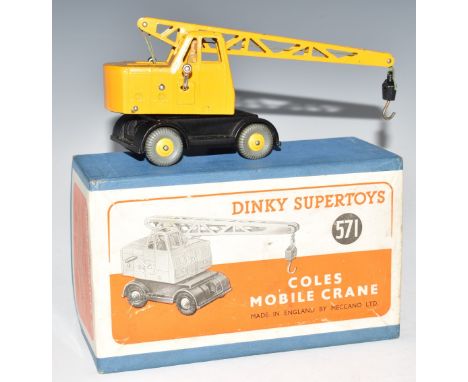 Dinky Supertoys diecast model Coles Mobile Crane with hoisting jib raising and slewing movements, black bed, yellow body and 