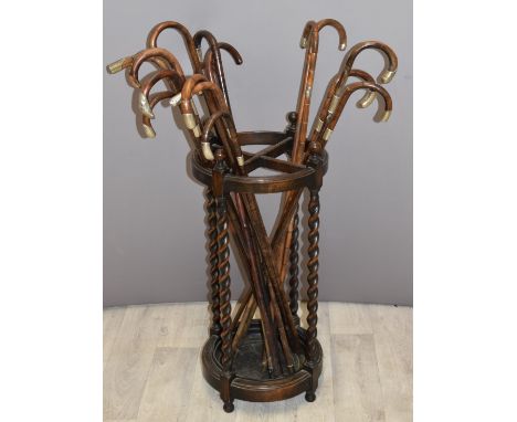 Seventeen late 19thC /20thC walking canes, most with hallmarked silver / white metal mounts, in a stick / umbrella stand with