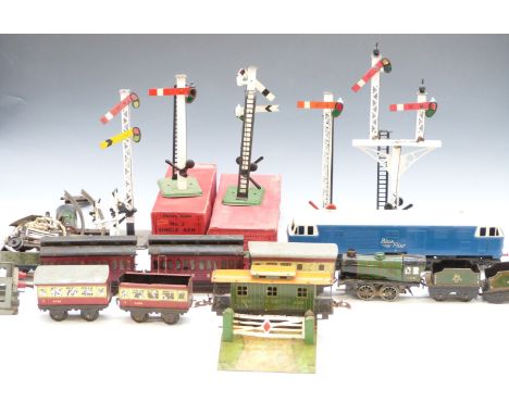 A collection of 0 gauge model railway items including locomotives, coaches, signals etc, some in original boxes.&nbsp;