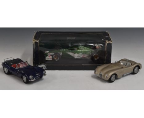 Three 1:18 scale die-cast models comprising Autoart Jaguar XK SS, Jaguar C-Type and Hotwheels 2000 Racing Jaguar R1 Eddie Irv