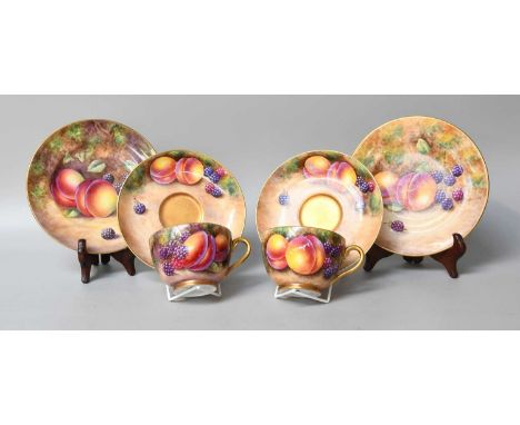 A Pair of Royal Worcester Porcelain Trios, by P. Lynes, M. Holloway &amp; J. Smith, painted with still lifes' of fruit on a m