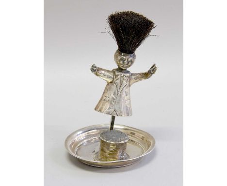 A George V Novelty Silver Inkwell and Pen-Wipe, Birmingham, 1910, Design Registration Number Rd 569140, modelled as a figure,