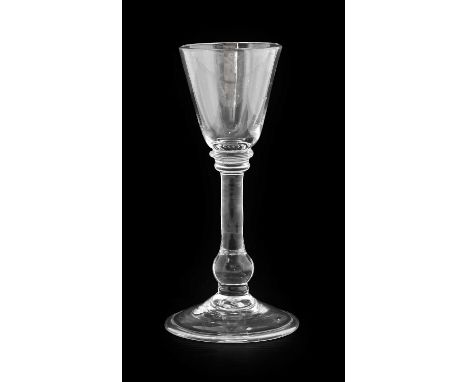 A Balustroid Wine Glass, circa 1740, the rounded funnel bowl on an annular knop, plain stem with basal knop and folded foot16