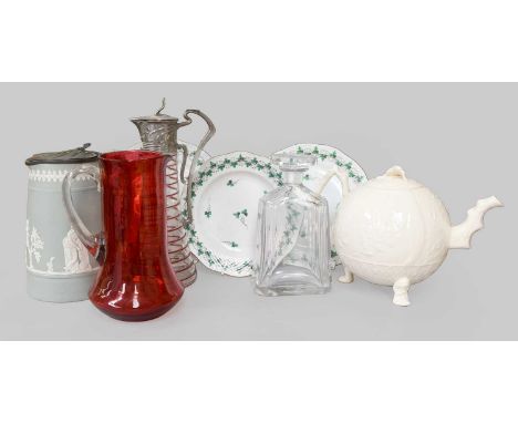 Decorative Pottery and Glass Comprising: a red swirled glass jug with Art Nouveau embossed mount, relief decorated jug, Orref
