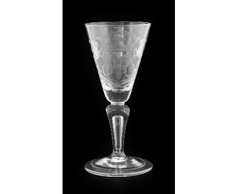 A Dutch Engraved Wine Glass, circa 1740, the rounded funnel bowl with an armorial on a four-sided pedestal stem with air tear