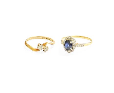 A Diamond Two Stone Twist Ring, stamped '18C', finger size K; and A Sapphire and Diamond Cluster Ring, finger size OThe '18C'