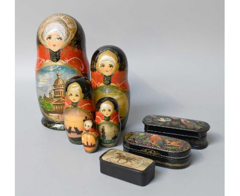 A Georgian Papier Mache Snuff Box, decorated with a trotting scene, A Painted Russian Nesting Doll and Two Russian Painted Bo