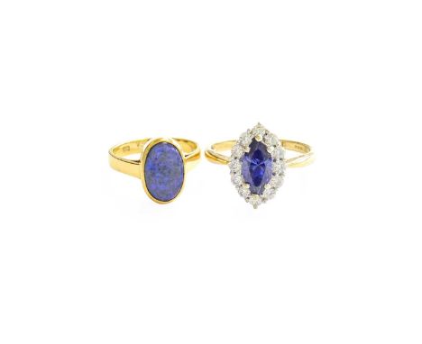 An Opal Ring, stamped '750', finger size L1/2; and A 14 Carat Gold Cubic Zirconia Cluster Ring, finger size TDue to the limit