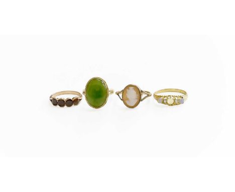 Four Gem-Set Rings, comprising of a nephrite ring, stamped '14K', fingers size N; a cameo ring, stamped '9CT', finger size Q1