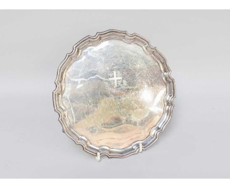 An Elizabeth II Silver Salver, by Garrard and Co, Ltd., Sheffield, 1979, shaped circular and on three scroll feet, engraved w