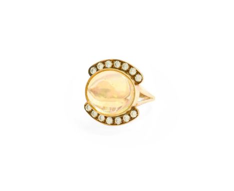 An Opal and Diamond Ring, the oval cabochon opal in a yellow rubbed over setting, flanked by rows of round brilliant cut diam