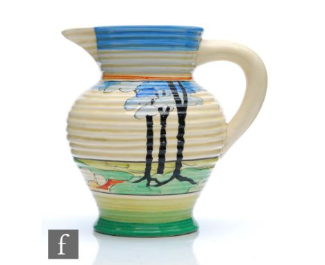 A Clarice Cliff Blue Firs pattern shape 564 George shape jug circa 1933, hand painted with a stylised coastal landscape with 