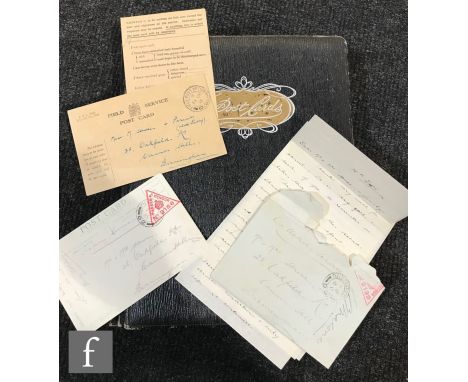An Edwardian postcard album of World War One postcards containing real photographic cards of biplanes, military camps and man