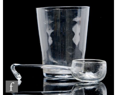 A late Georgian oversized tumbler of plain cylindrical form, height 15cm, together with a late Georgian clear crystal glass l