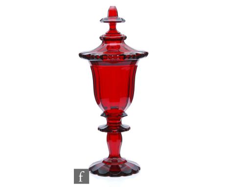 A large 19th Century Bohemian ruby chalice and cover, possibly Moser or Neuwelt, the petal edged and facet foot rising to a f