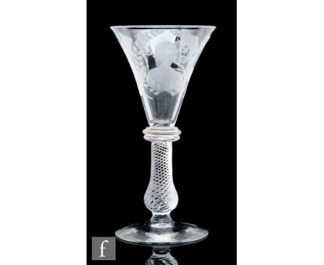 A late 19th Century reproduction Jacobite drinking glass in the 18th Century style, the flared trumpet bowl engraved with a p