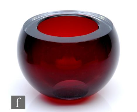 A contemporary studio glass bowl, of spherical form with slice cut rim, internally decorated in ruby and heavily cased in cle