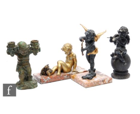 A 20th Century spelter study of Cupid with gilt details, raised to a square marble base, height 23cm, together with another s