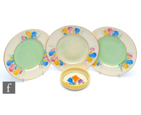 A large Clarice Cliff circular pin dish circa 1930, hand painted in the Crocus pattern within yellow and green banding, CROCU