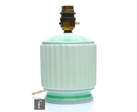 A 1930s Art Deco Shelley green lamp base, the fluted body with green banding to the neck, printed mark, height 20cm. 