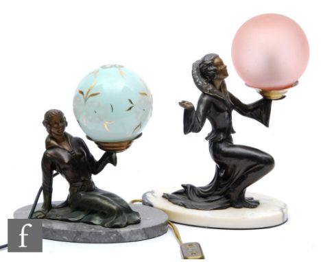 A 20th Century spelter table lamp decorated with a stylish kneeling female figure holding a frosted pink sphere glass shade, 