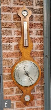 A 19th Century oak cased wheel barometer incorporating thermometer, hygrometer and level, S/D