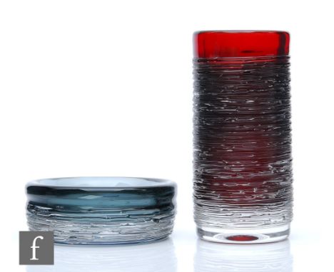 A post war glass vase by Bengt Edenfalk for Skruf, of cylindrical form decorated with fine clear spun trails over a deep ruby