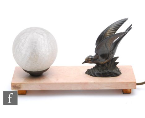 An Art Deco style table lamp, the marble base mounted with a sphere and a bird, width 37.5cm. 