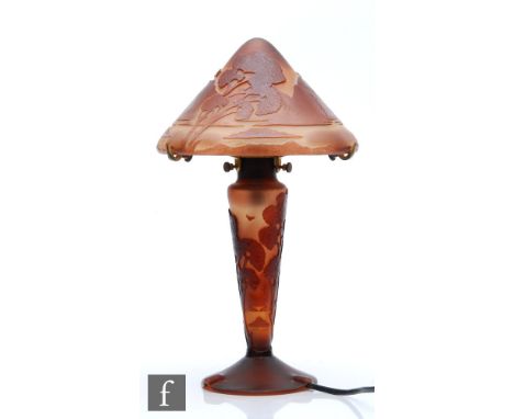 A later 20th Century cameo glass table lamp in the Art Nouveau style, the conical form shade above a tapered slender column a