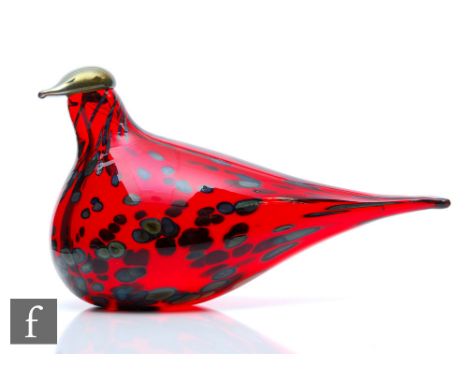 A contemporary Oiva Toikka glass Ruby Bird for Iitalla, modelled as a stylised seated bird in red with petrol iridescent gree