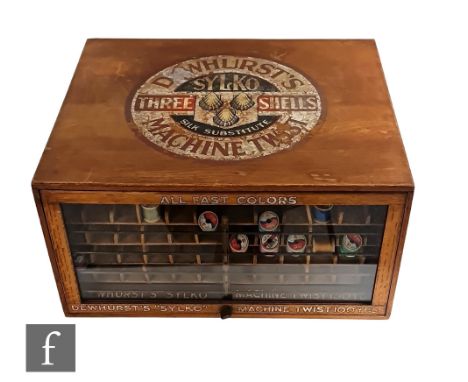 A Dewhurst's Three Shells Sylko machine thread counter top advertising display cabinet, with glazed front and back panels and