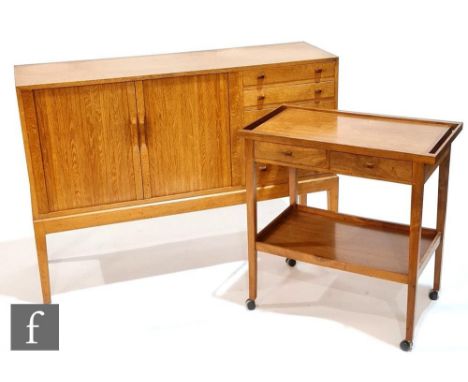 A Cotswold School style oak sideboard, designed and made by&nbsp;M.L. Richardson, fitted with an arrangement of five drawers 