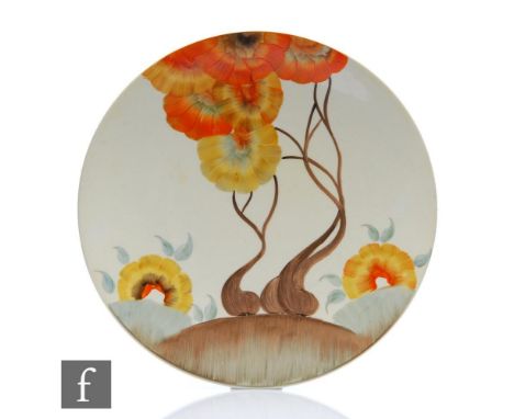 A Clarice Cliff Rhodanthe pattern large circular dish form plate circa 1934, hand painted with a stylised tree landscape, A.J