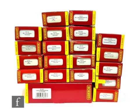 A collection of OO gauge Hornby rolling stock, to include a car transporter, bogie bolsters, hopper wagons etc, all boxed. (2