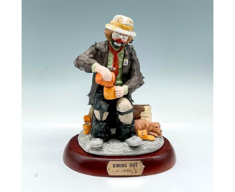 Matte finished figural sitting on side of road with his dog making dinner. Signed. Limited edition 7518 of 12000. Flambro Imp
