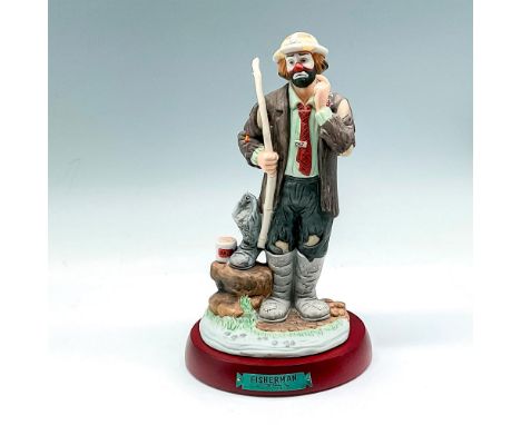 Part of the Professional Series, matte finished figural dressed in his tattered clothes holding a pole ready to fish. Signed.