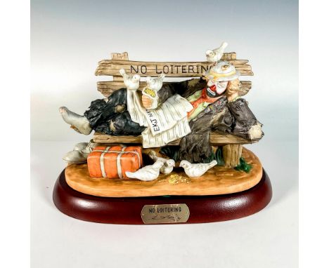 Limited edition, hand painted bisque porcelain depicting figural clown Weary Willie resting on a bench where doves eat his sn
