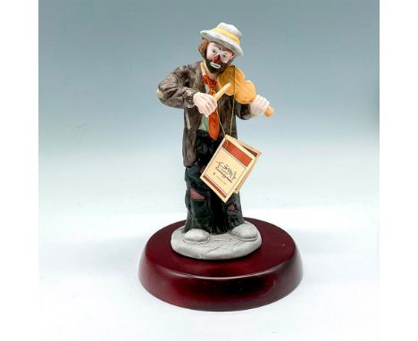 Part of the EKJ collection, colorful figural playing instrument in tattered clothes. Flambro Imports backstamp, This item has