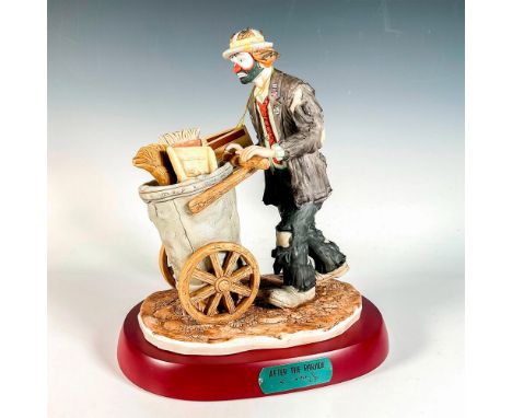 Limited edition, hand painted bisque porcelain depicting figural clown Weary Willie pushing his cart full of cleaning tools. 