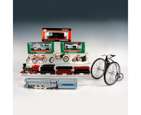 Large toy grouping featuring a mini penny-farthing, Department 56 Harley Davidson figurine of two motorcycles, Schwinn Apple 