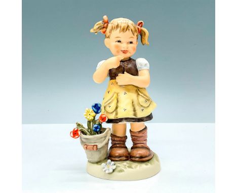 Hummel porcelain figure featuring cute little girl pointing finger and smiling. Goebel backstamp TMK8. M. I. Hummel impressed