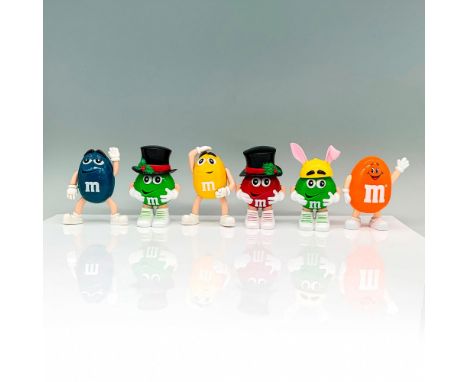 A set of 6 various M and M character figures in various poses and colors, with some wearing hat accessories. Dimensions of th
