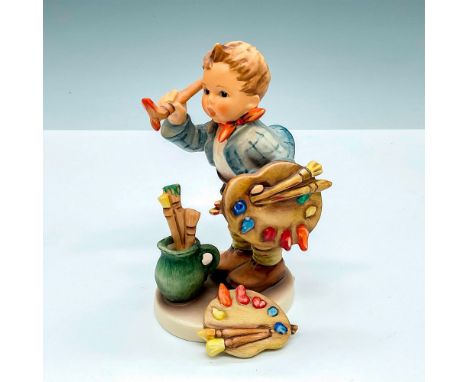 Hummel porcelain figure featuring young boy painting and charming pin of artist's palette. Goebel backstamp TMK7. M. I. Humme