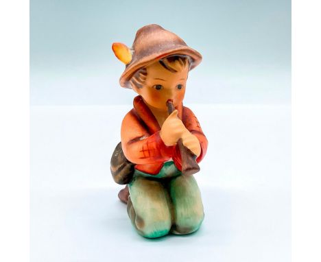 Hand painted figure of a young boy playing the horn. Goebel backstamp. Artist: M.I. HummelIssued: c. 1972-1979Dimensions: 3"L