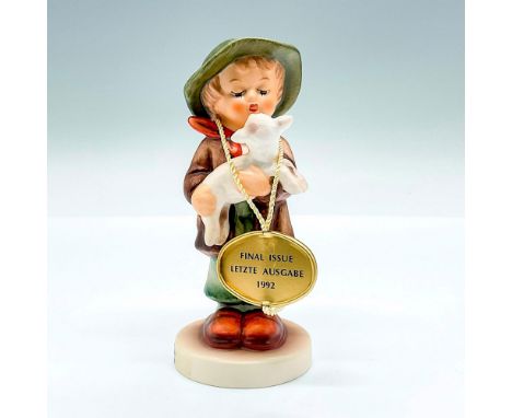 Hand painted figure of a young boy helping a little lamb. Goebel backstamp. This item has its original box: 5.75"L x 3.75"W x